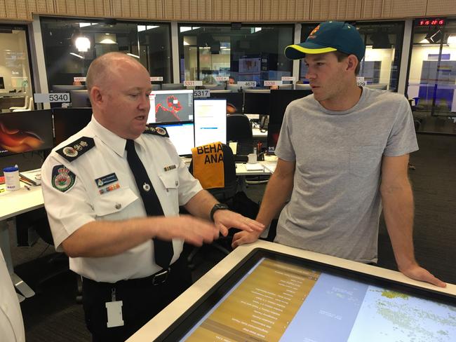 Pain gets a briefing from RFS Commissioner Shane Fitzsimmons at headquarters. Picture: RFS