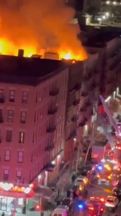 Onlookers horrified as large fire engulfs Manhattan residential building