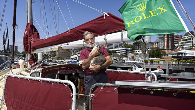 SYDNEY, AUSTRALIA, NOVEMBER 22, 2023. Sylph VI skipper and owner Robert â€˜Bobâ€™ Williams with his cat Oli who will sail with Bob in the Sydney to Hobart yacht race on board Sylph VI. Photographer: Adam Yip