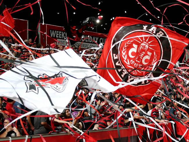 Fans welcome their team onto the ground before the ALeague game between the Western Sydney Wanderers and the Central Coast Mariners at Pirtek Stadium,Parramatta.Picture Gregg Porteous