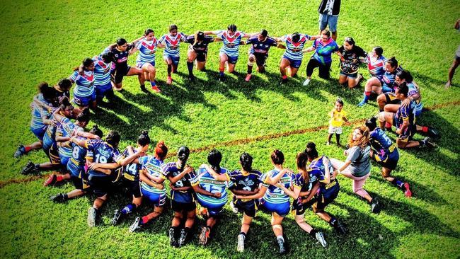 Players from the Innisfail Leprechauns and Edmonton Storm women's teams huddle following the death of Innisfail footballer Ailsa Satini. Picture: Facebook/ Innisfail Leprechauns RLFC