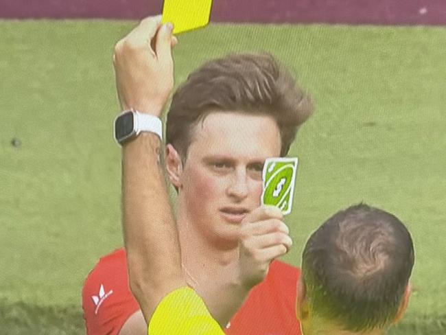 Comedian Max Fosh produces an Uno reverse card in response to being booked in a charity match.