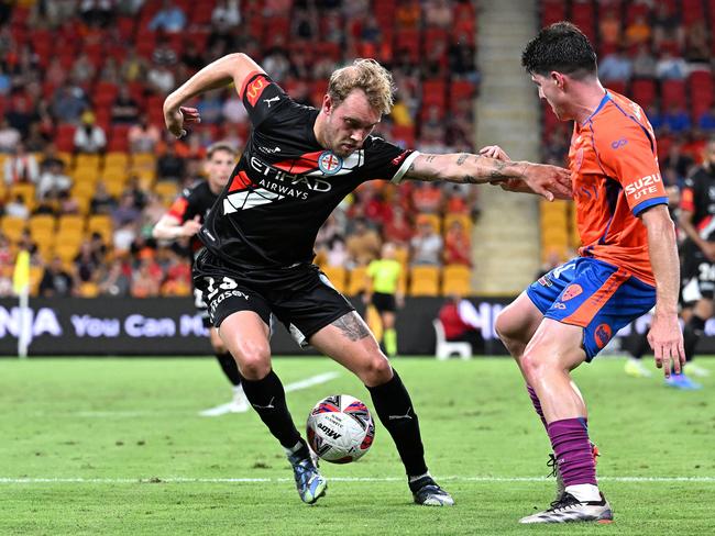 Nathaniel Atkinson of Melbourne City is challenged by Louis Zabala of the Roar during the round seven A-League Men match between Brisbane Roar and Melbourne City at Suncorp Stadium. Picture: Bradley Kanaris/Getty Images.