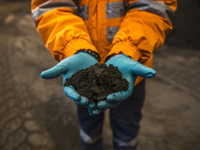 A miner in Peru holds copper concentrate. Picture: Picture: Bloomberg