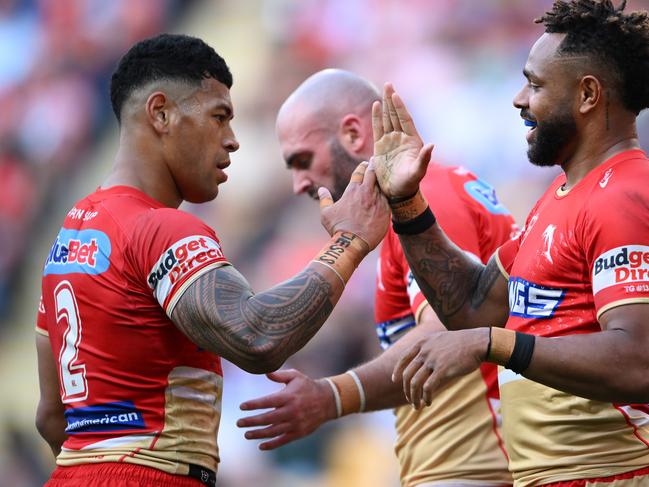 BRISBANE, AUSTRALIA - AUGUST 11: Hamiso Tabuai-Fidow and Jamayne Isaako of the Dolphins celebrate during the round 23 NRL match between Dolphins and New Zealand Warriors at Suncorp Stadium, on August 11, 2024, in Brisbane, Australia. (Photo by Matt Roberts/Getty Images)