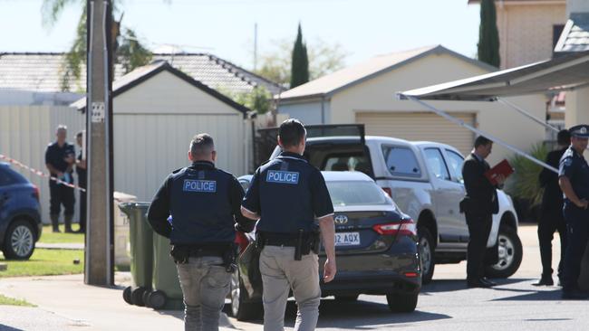 Police at the Woodville West home on Wednesday. Picture: Emma Brasier.