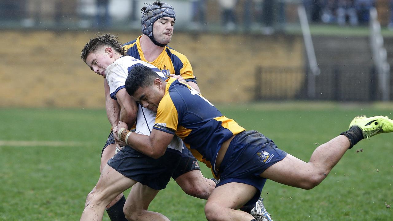 NSW's Jackson Lill tackled by ACT.
