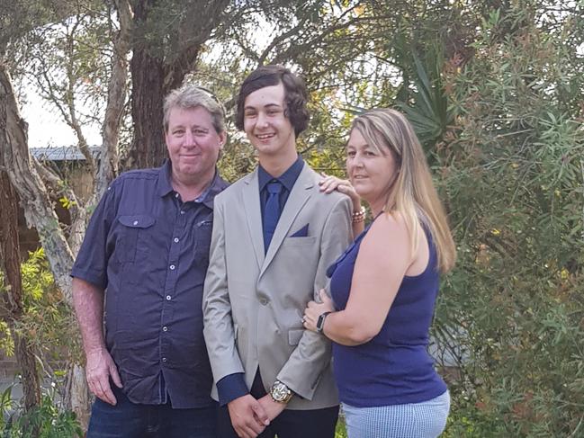 Cohn Evans, mum Dolly Evans and dad Jason Evans outside their old family home. Picture: Supplied