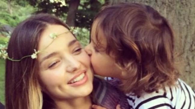 Loves his mum ... Flynn Bloom gives his supermodel mum Miranda a kiss on the cheek.