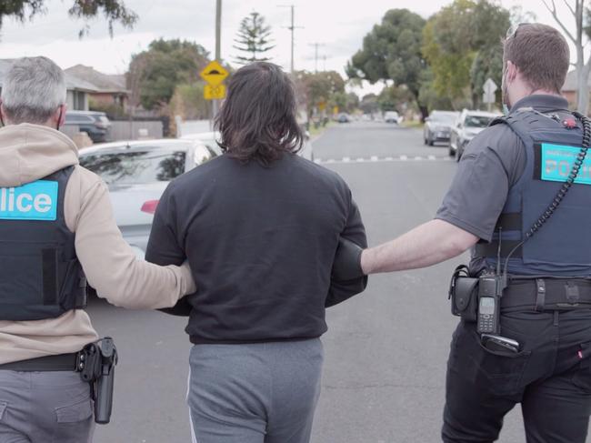 Police make an arrest in Glenroy, Melbourne, during Operation Ironside.