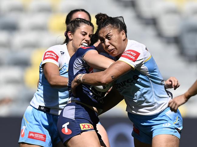 TOWNSVILLE, AUSTRALIA - AUGUST 17: Lily Peacock of the Cowboys is tackled by Shannon Mato of the Titans during the round four NRLW match between North Queensland Cowboys and Gold Coast Titans at Queensland Country Bank Stadium on August 17, 2024 in Townsville, Australia. (Photo by Ian Hitchcock/Getty Images)