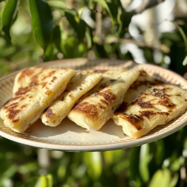 The staple Greek tradition of fresh pita bread is a hit at Thanks to Theo.