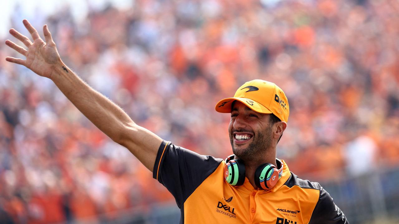 McLaren's Australian driver Daniel Ricciardo waves to the public