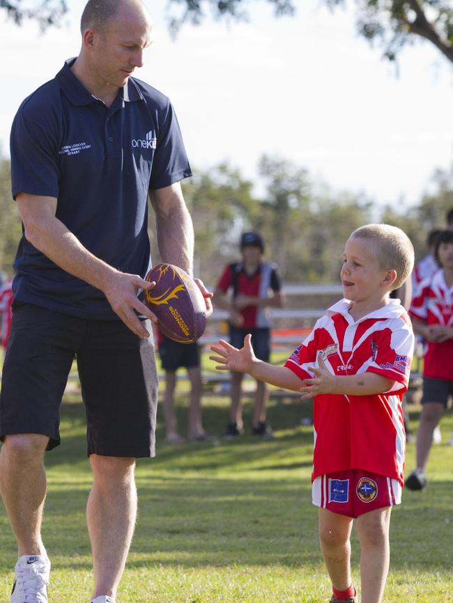 Darren Lockyer and a young Kale Oliver during a meet and greet at the Dysart Junior League club in 2012.