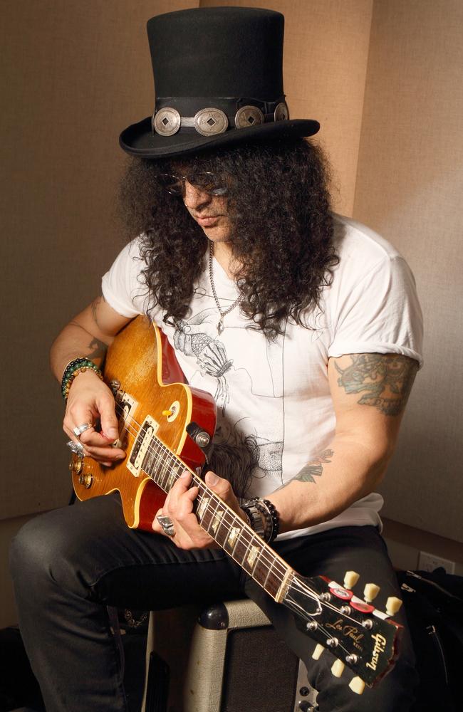 Slash is ALWAYS playing a guitar. Picture: Supplied