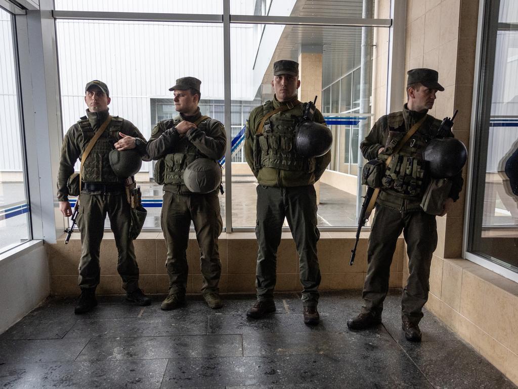 Ukrainian army soldiers stand guard at the Chernobyl Nuclear Power Plant. Picture: Getty Images