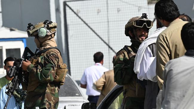 Taliban special forces at a checkpoint as airport employees queue to enter to the Kabul International Airport at the weekend. Picture: AFP