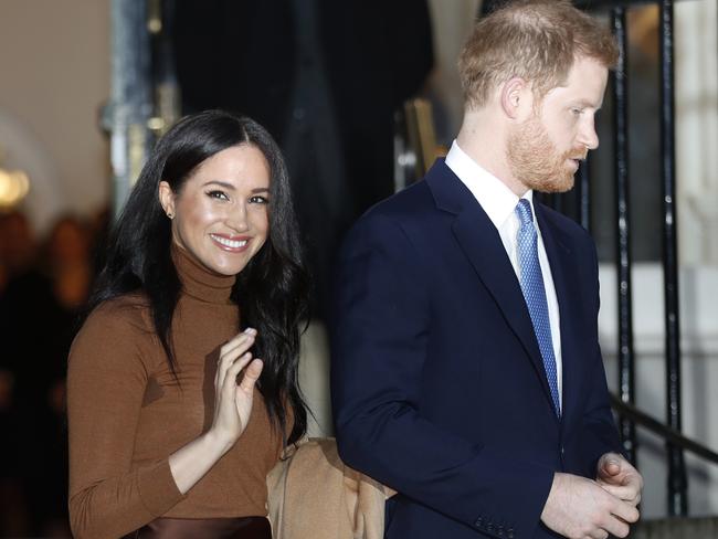 FILE - In this Jan. 7, 2020, file photo, Britain's Prince Harry and Meghan, Duchess of Sussex leave after visiting Canada House in London, after their recent stay in Canada. Prince Harry and Meghan Markle are to no longer use their HRH titles and will repay Â£2.4 million of taxpayer's money spent on renovating their Berkshire home, Buckingham Palace announced Saturday, Jan. 18. 2020. (AP Photo/Frank Augstein, File)