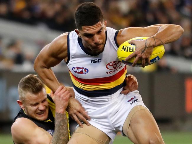 MELBOURNE, AUSTRALIA - JULY 06: Curtly Hampton of the Crows is tackled by Brandon Ellis of the Tigers during the 2018 AFL round 16 match between the Richmond Tigers and the Adelaide Crows at the Melbourne Cricket Ground on July 06, 2018 in Melbourne, Australia. (Photo by Michael Willson/AFL Media/Getty Images)