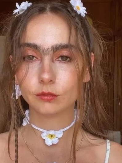 A body positive influencer revealed she doesn't shave her unibrow or body hair. Picture: TikTok/ the.unibrowgirl