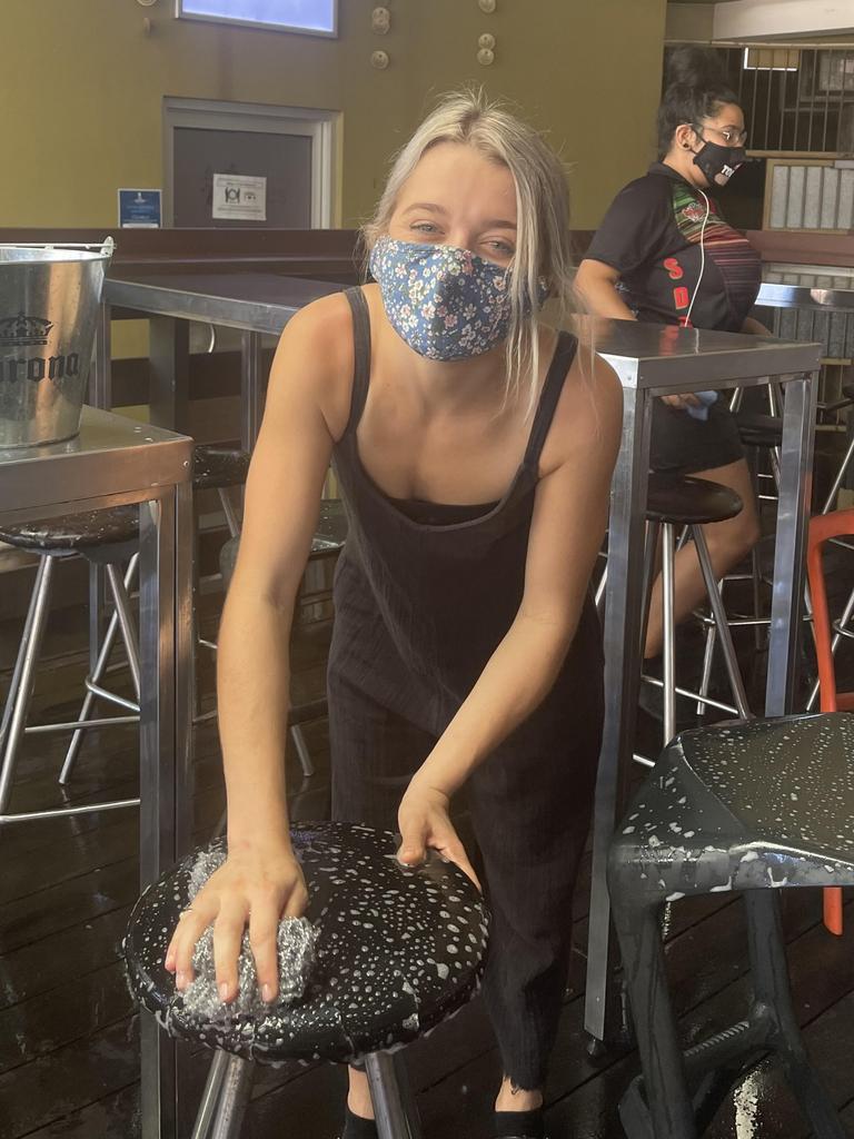 Abi Brill from the Tap Bar prepares for the venue to reopen at noon after the Greater Darwin lockdown was lifted. Picture: Glenn Campbell