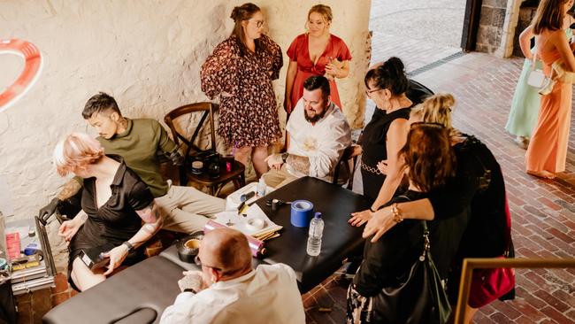 Chantel and Travis Twist had a tattooist at their wedding reception so guests could get a memento of the occasion if they wished. Picture: Single Soul