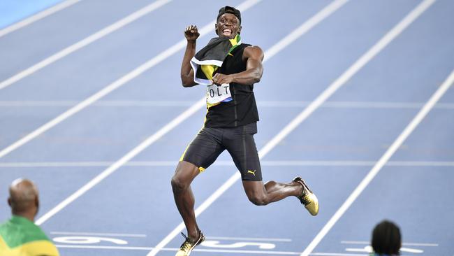 Usain Bolt celebrates winning gold in the men’s relay. Photo: Photo/Martin Meissner