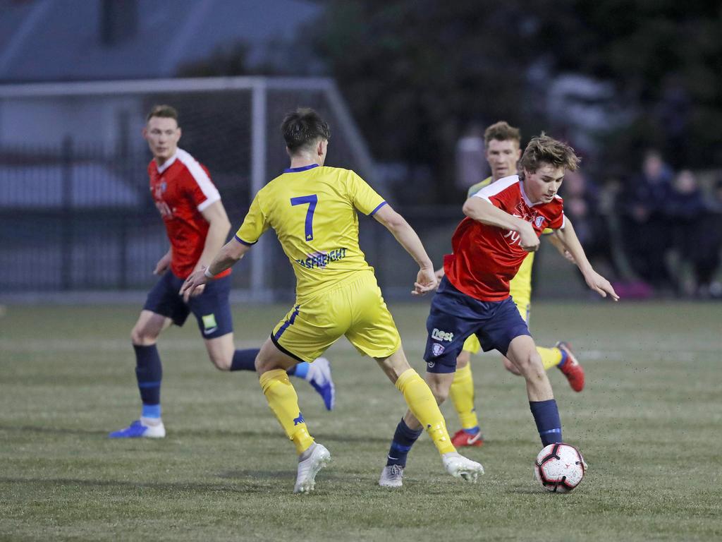 Lokoseljac Cup Final at KGV. Devonport Strikers versus South Hobart. South Hobart's Bradley Lakoseljac takes on Daniel Syson. Picture: PATRICK GEE