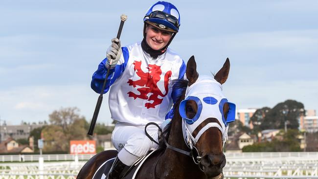 Jamie Kah returns to scale on Mr Quickie after winning the Toorak Handicap.