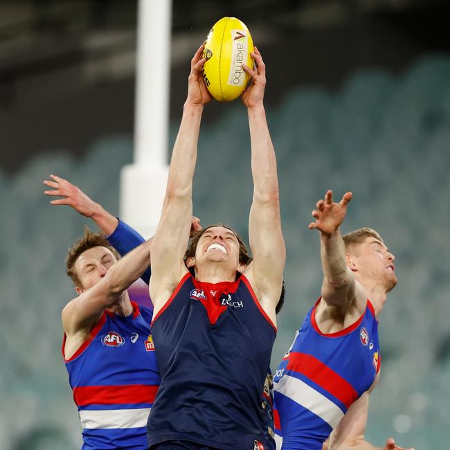 Ben Brown of the Demons marks the ball ahead of Bailey Dale and Tim English of the Bulldogs (right) in his best game of the season. Picture: Michael Willson/AFL Photos via Getty Images