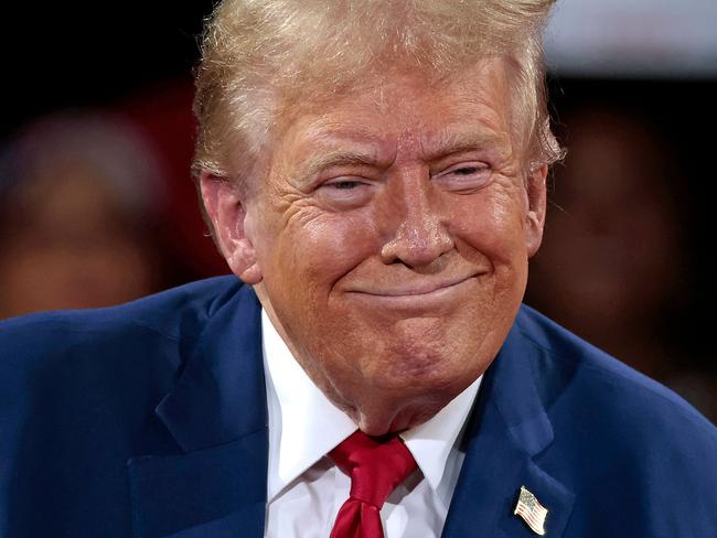 Former US President and Republican presidential candidate Donald Trump attends a town hall meeting moderated by Arkansas Governor Sarah Huckabee Sanders at the Dort Financial Center in Flint, Michigan, on September 17, 2024. (Photo by JEFF KOWALSKY / AFP)