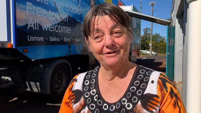 Regional library manager Lucy Kinsley. She is pictured with the second-hand trailer after the floods last year.