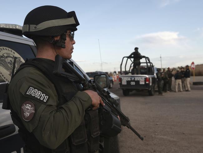 Chihuahua state police officers man a checkpoint in Janos, Chihuahua state, northern Mexico. Picture: AP