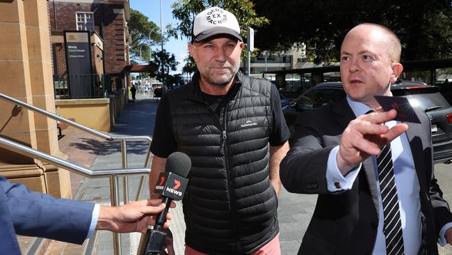 Former Australian cricketer Michael Slater leaving Manly police station. Picture: Richard Dobson