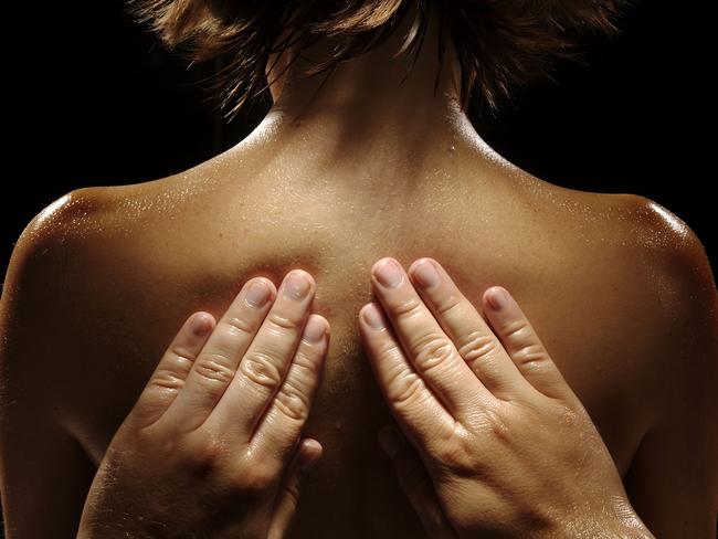 Massage pics - generic. Hands on a woman's back.