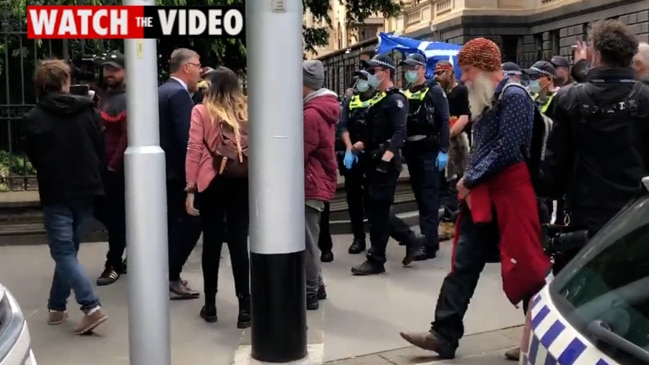 Protesters harass media as they occupy the steps of Victoria's Parliament House