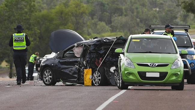 Police investigators on the scene of the fatal multiple-vehicle crash on Tiger Brennan Drive, which killed a 57-year-old woman. Picture: Che Chorley