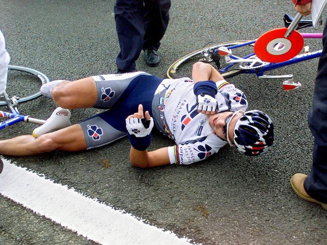 Australian Bradley McGee is on ground after falling during the first stage of the 88th Tour de France. T