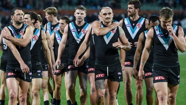 Port Adelaide players leave Adelaide Oval after the heartbreaking loss to Collingwood. Picture: Getty Images