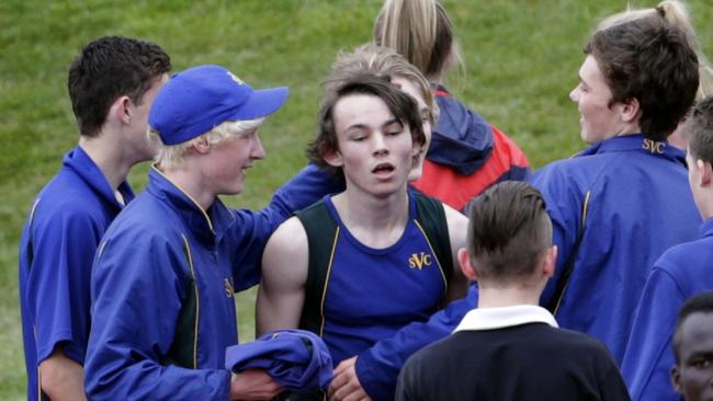 Jack Hale is congratulated by school mates after breaking the national under 18 record.