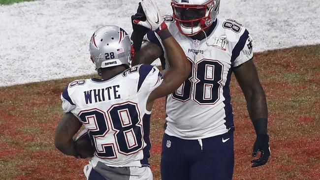 James White celebrates with Martellus Bennett after scoring a touchdown against the Falcons. Picture: Getty