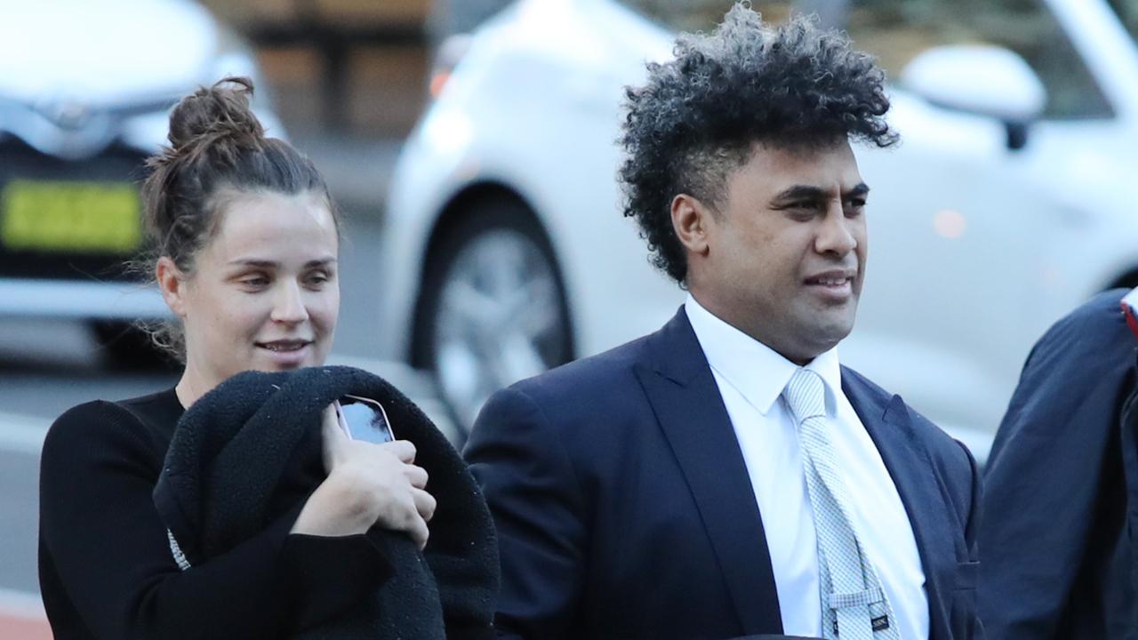 Former Parramatta Eels centre Michael Jennings with his partner outside court.