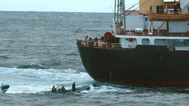 SAS troops in inflatables prepare to board Korean frigate Pong Su off Newcastle.