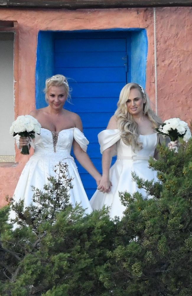 Rebel Wilson and fashion designer Ramona Agruma look stunning at their wedding at the Hotel Cala di Volpe in Sardinia, Italy, on September 28. Picture: CIAOPIX / COBRA TEAM / BACKGRID