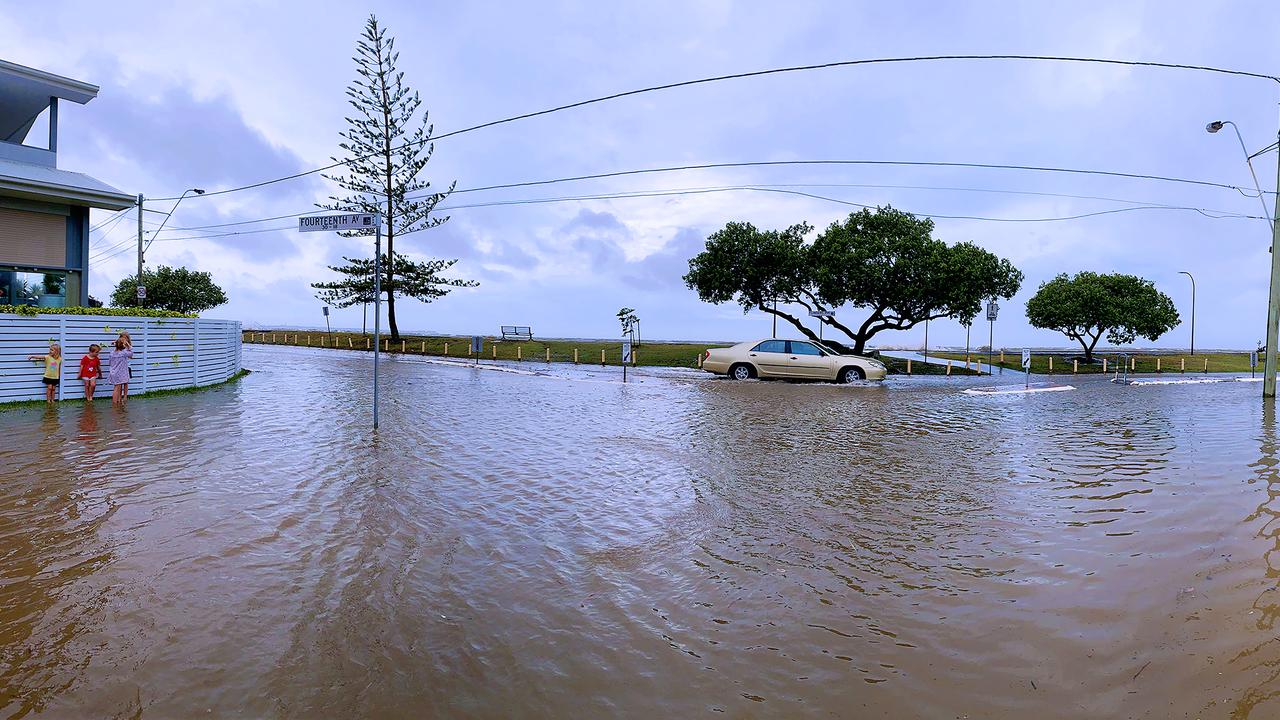 Life goes on in Sandgate despite the flood waters. PHOTO CREDIT: Dianna Jean Photography.