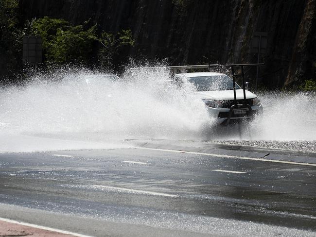 SYDNEY, AUSTRALIA - NewsWire Photos SEPTEMBER 12, 2022: Cars drive through water on Epping Road in Lane Cove after a water main caused traffic congestion. Businesses and residents on Sydney's north shore are into their third day of water outages, after a burst main went unrepaired since Saturday. Picture: NCA NewsWire / Nikki Short