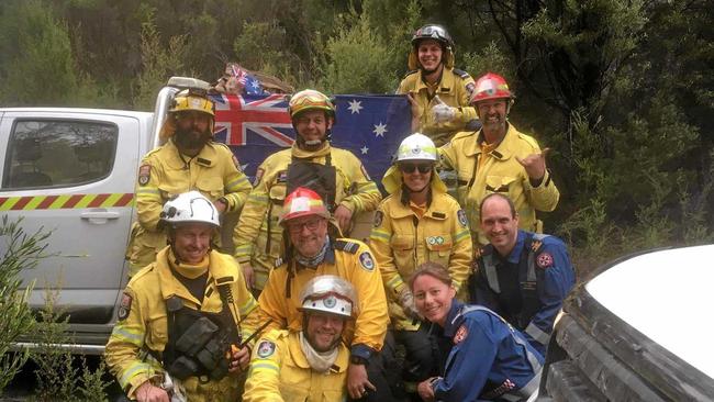 Clarence Valley volunteers Paul Johnston, Kirra Innes, Scott Campbell and Cody Jones with interstate crews in Tasmania. Picture: Peter Le Breton