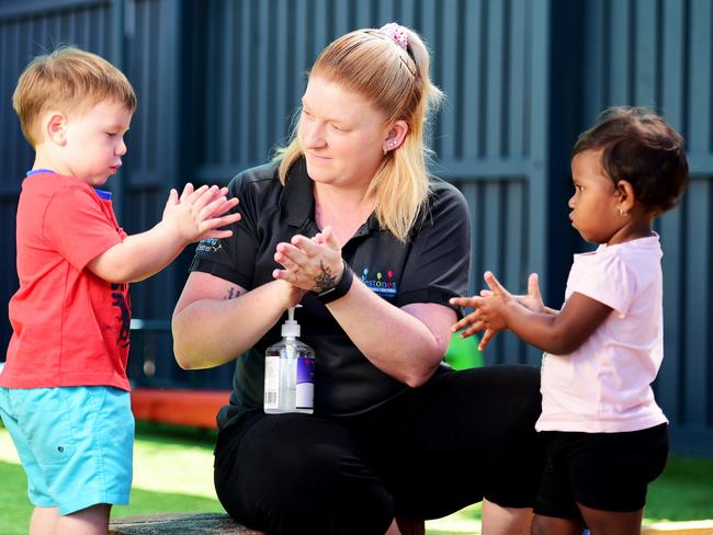 Milestones Early Learning The Lakes; Lead Educator Melissa Laundess with Nate Bannister 2 and Lillian Baira 2, sanitising their hands