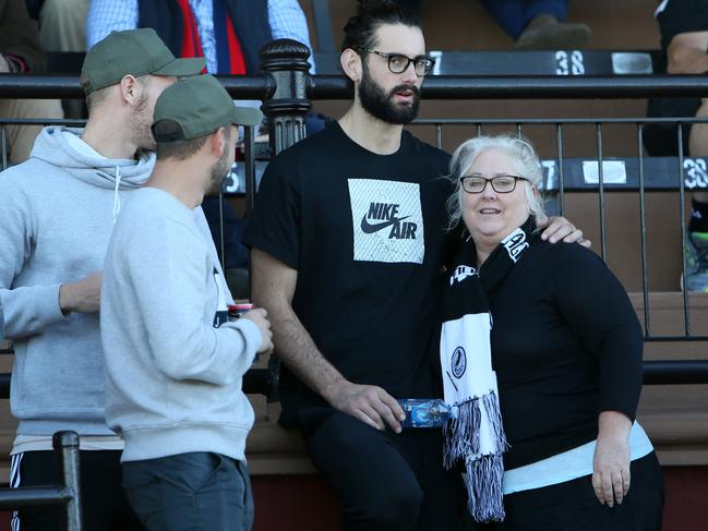 Collingwood ruckman Brodie Grundy, with his mum Jenn and friends watching from the stands at Alberton Oval while younger brother Riley played for Port Adelaide in the SANFL against Norwood. Picture: AAP/Emma Brasier