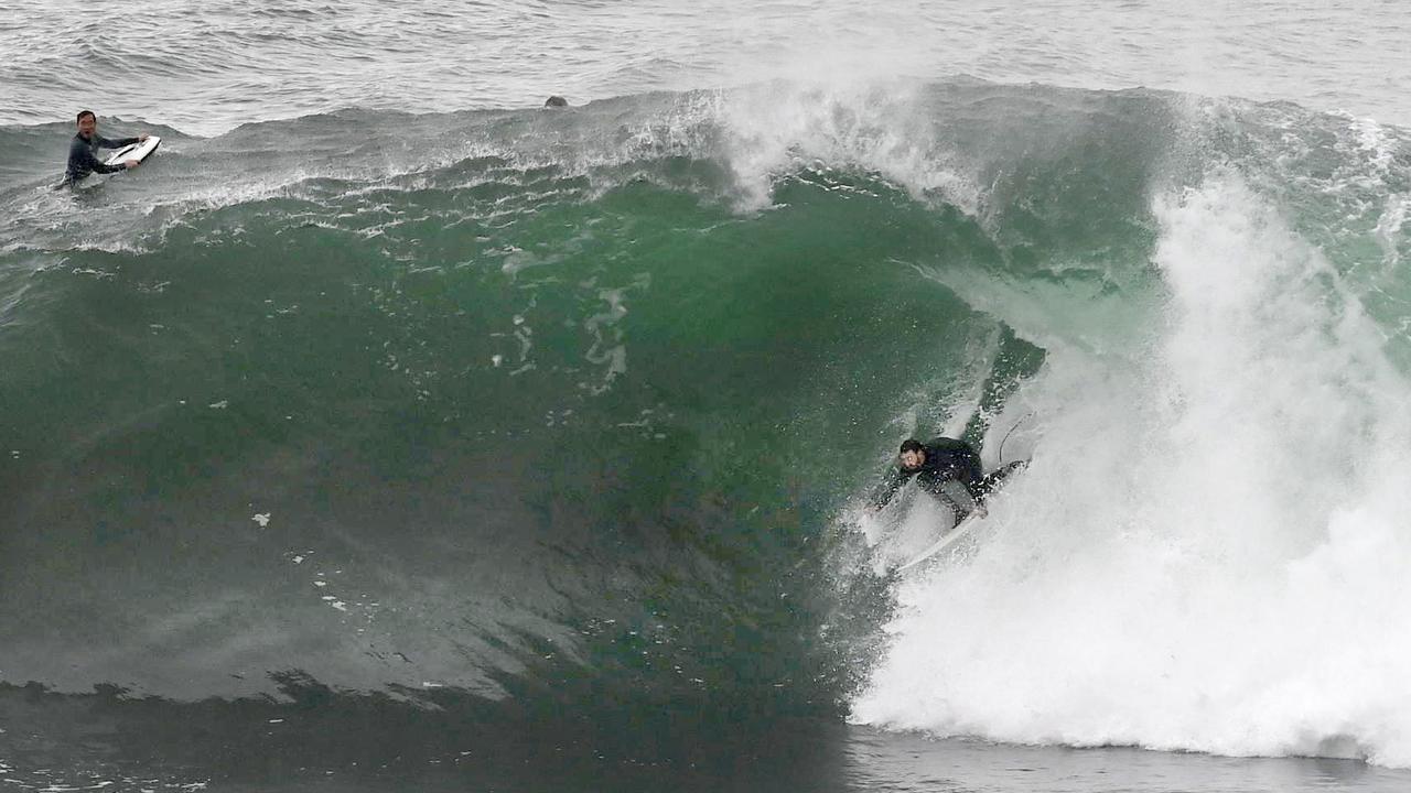 Surfers make the most of the storm swell at Deadman’s on Sydney’s Northern Beaches. Picture: NCA NewsWire / Jeremy Piper